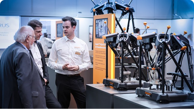 Renishaw engineers demonstrating measurement equipment